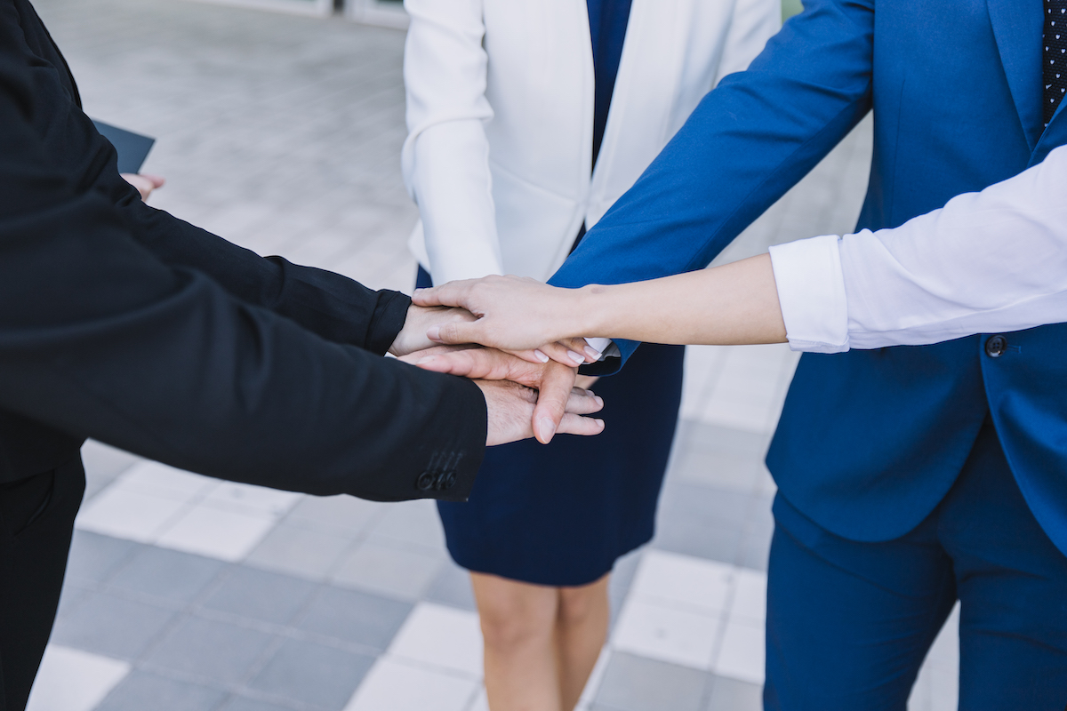 business-people-stacking-hands